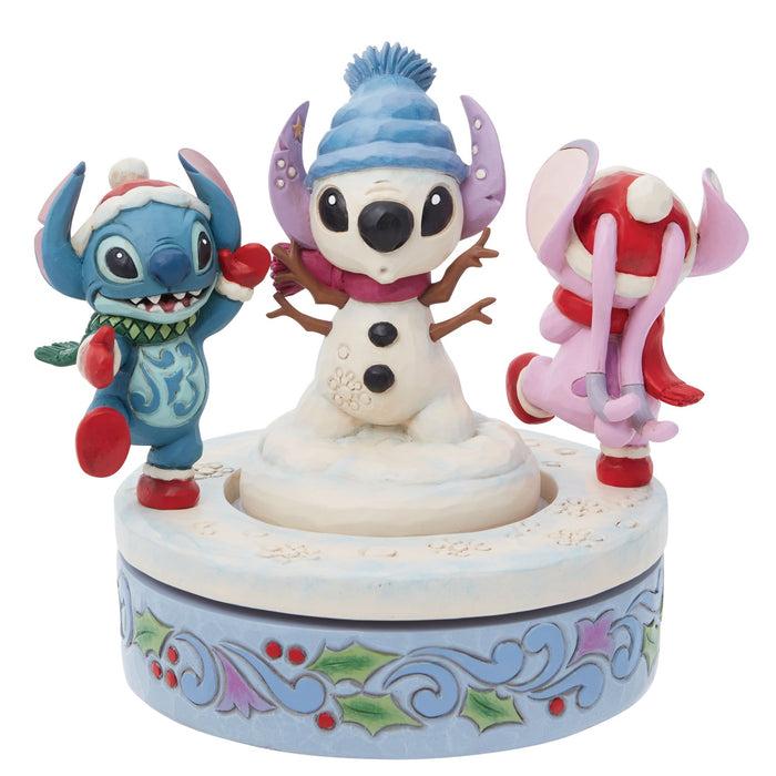Enesco Stitch & Angel Building a Snow