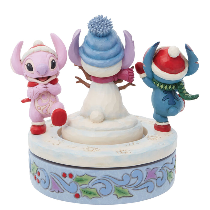 Enesco Stitch & Angel Building A Snow